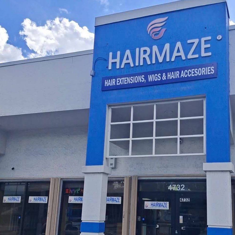 HAIRMAZE store front with blue sign and white building